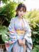 A woman in a blue kimono posing for a picture.